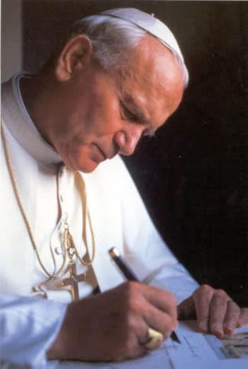 John-Paul II signing The Charter for Health Care Workers