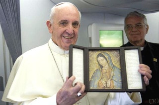 Pope Francis holding an image of Our Lady of Guadalupe