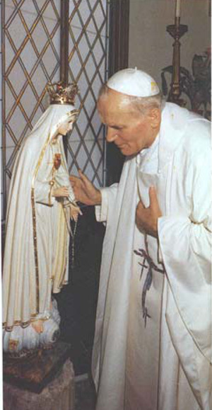  John Paul II with a statue of Our Lady of Fatima