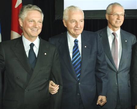 Andre Desmarais and Paul Desmarais Jr. with their father, Paul Desmarais Sr.