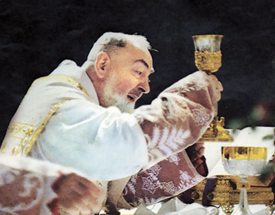 Padre Pio consecrating the wine