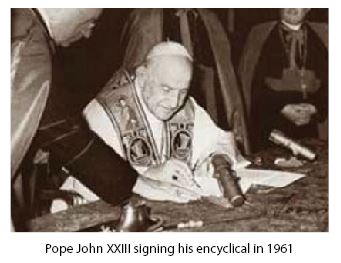 Pope John XXIII signing encyclical