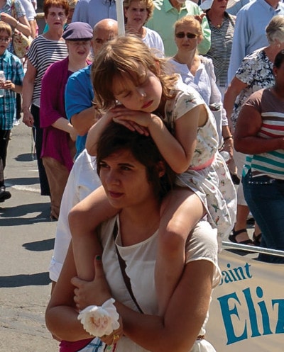 Aimie and Gracie Jacques participating in the procession